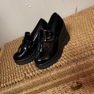 Black patent tassle wedge loafers
